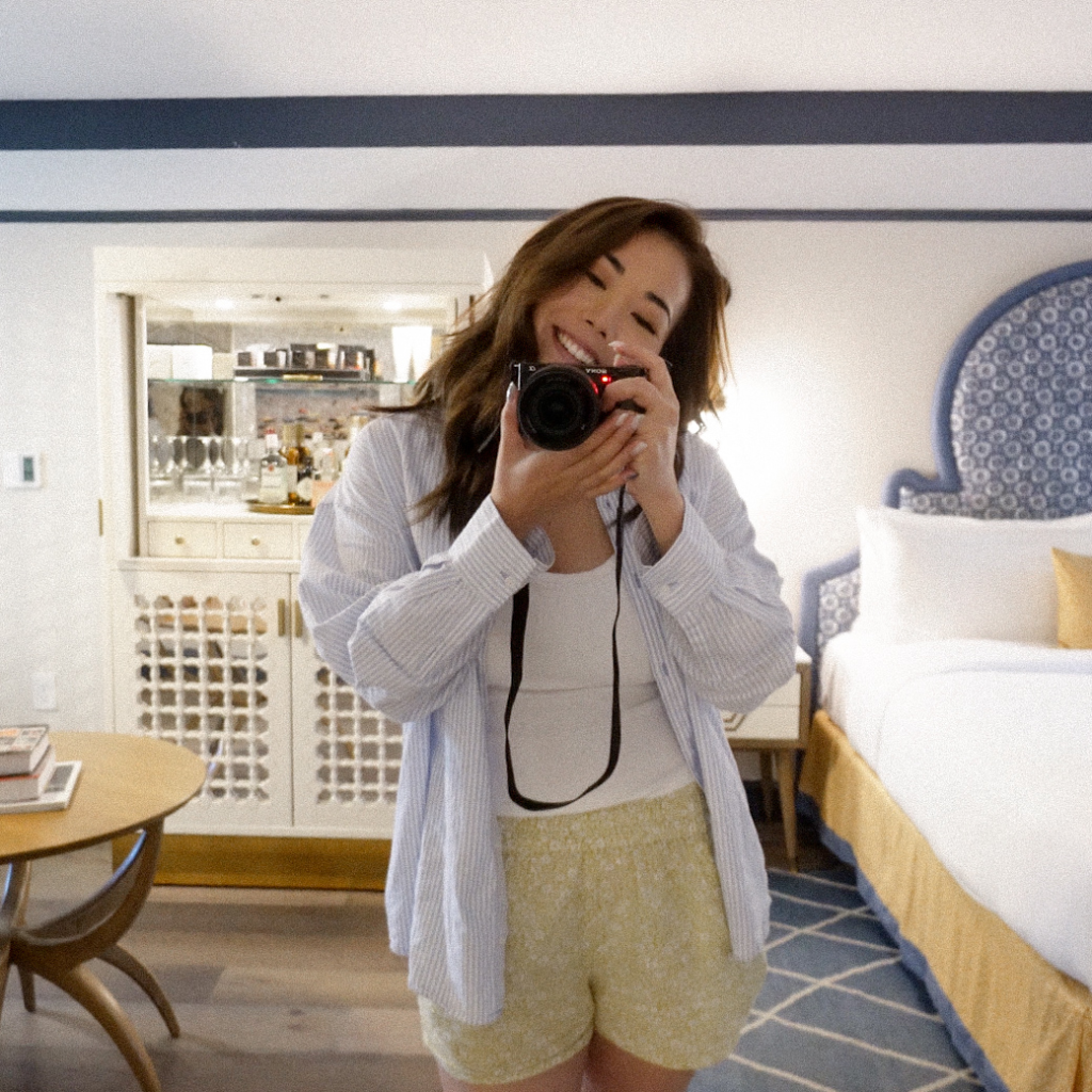 remi taking selfie with camera in mirror